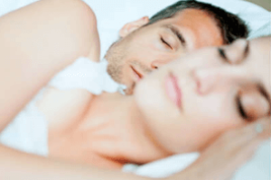 white male and female sleeping soundly together being able to let go of body tension being free of triggered states of mind