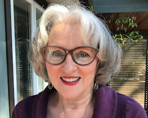 A headshot of dr lacombe on her sunny deck