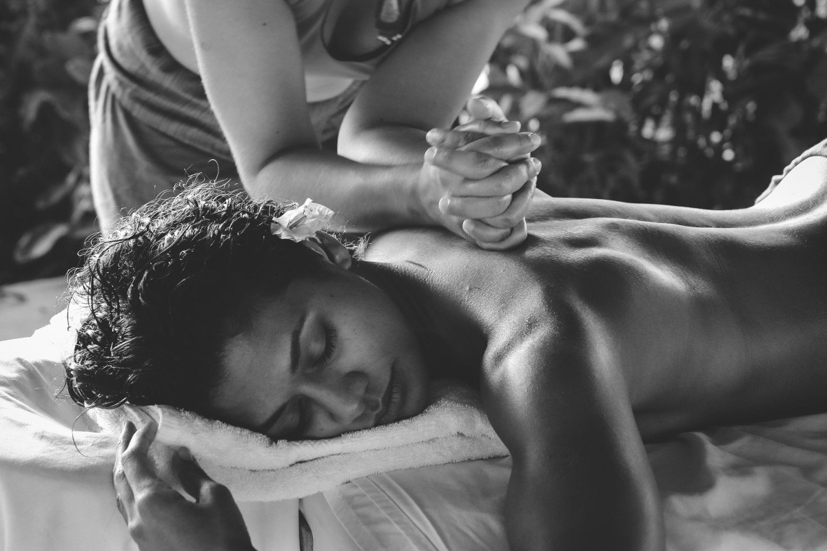female receiving holistic massage