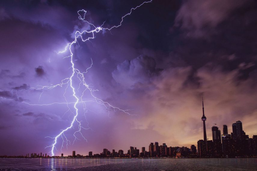 lightning strikes like flashbacks against city sky