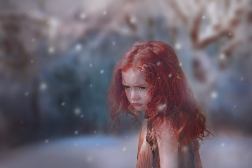 red haired young girl looking downcast showing what abandonment looks like