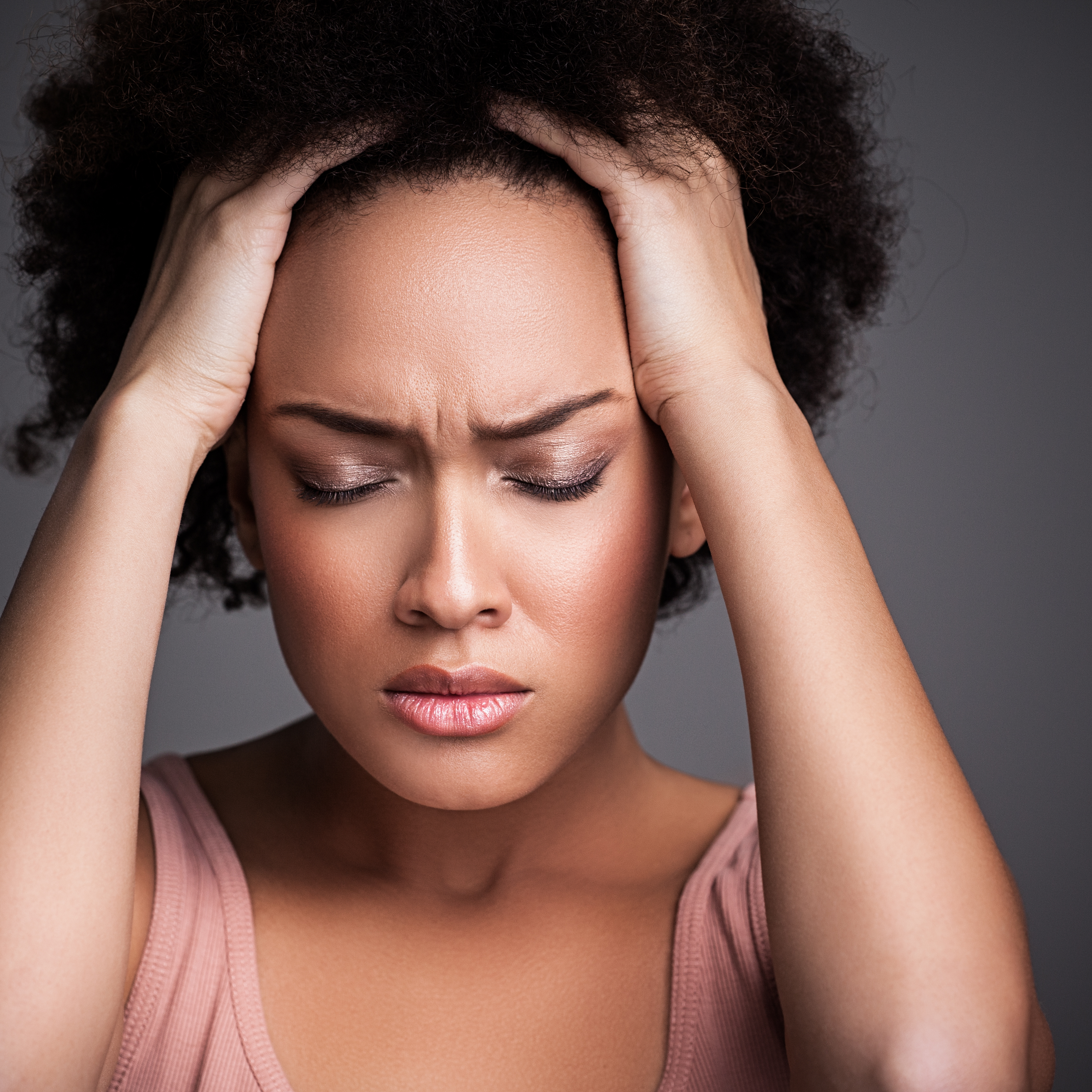 worried black woman who can't focus her mind